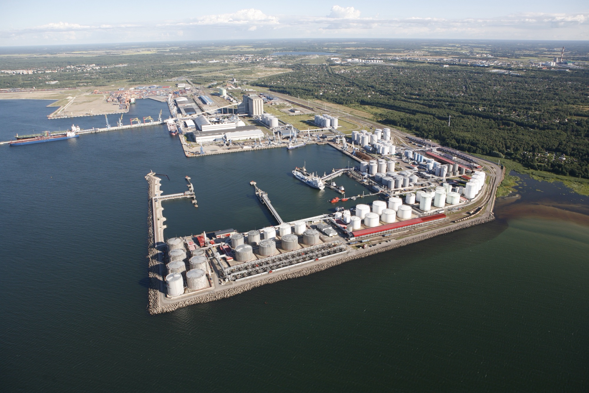 Liwathon E.O.S. storage tanks on the harbour peninsula at Muuga, Estonia, seen from the air.