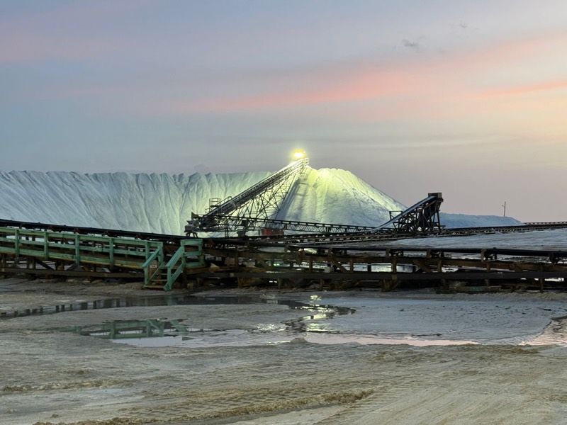 The floodlit salt stockpile and radial stacker at dusk, Lusca Salt works, Great Inagua.